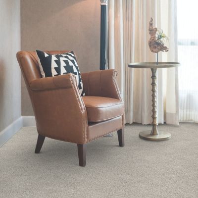 beige carpets in a living groom with leather chair and lamp